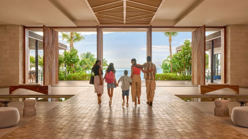 Family in lobby at Hilton Tulum Riviera Maya All Inclusive Resort