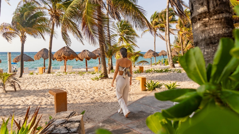 Lady on the beach at Grand Oasis Riviera