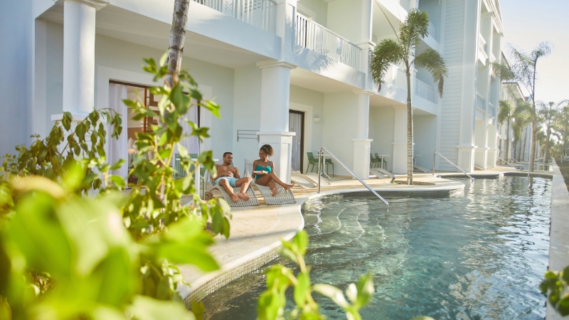 Couple by the pool at Bahia Principe Luxury Esmeralda