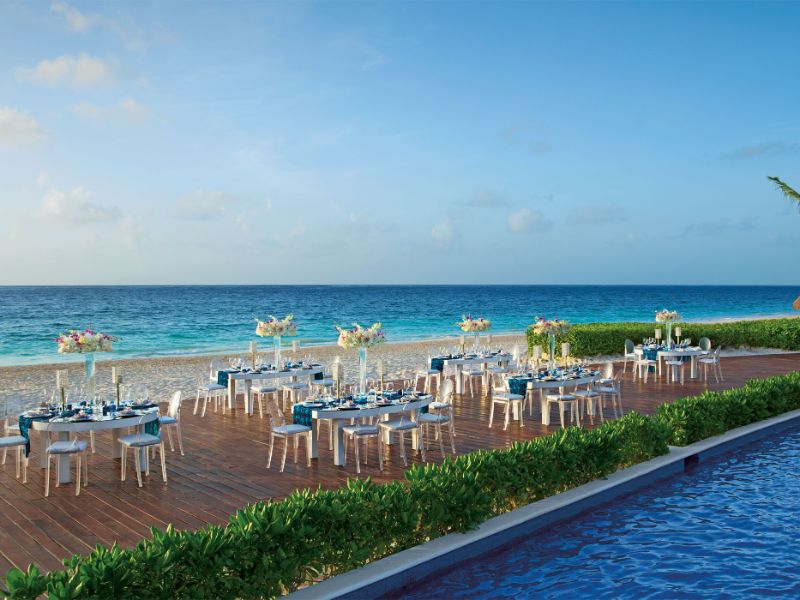 Beach front view Gala dinner set up during early evening