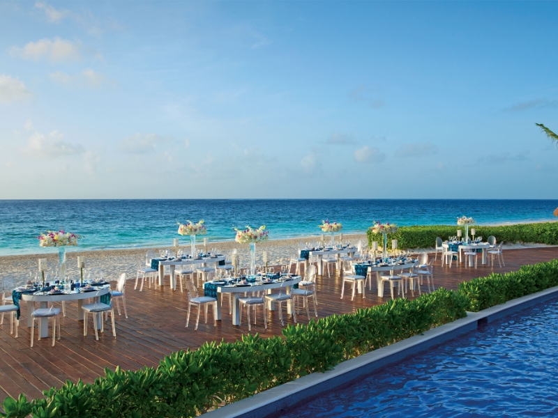Beach front view Gala dinner set up during early evening